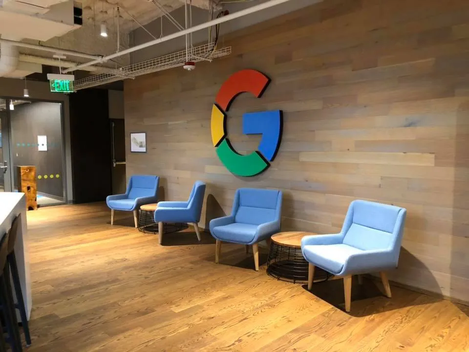 1 Wood Floors  Tech headquarters lobby hardwood flooring and reclaimed wood wall paneling Ann Arbor Michigan. Installed by 1 Wood Floors, Livonia, MI
