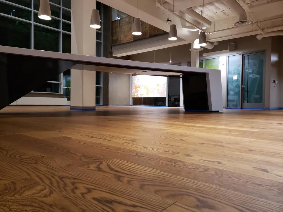 1 Wood Floors  Open-plan commercial hardwood floor restoration with 98% dust containment Ann Arbor Michigan. Installed by 1 Wood Floors, Livonia, MI