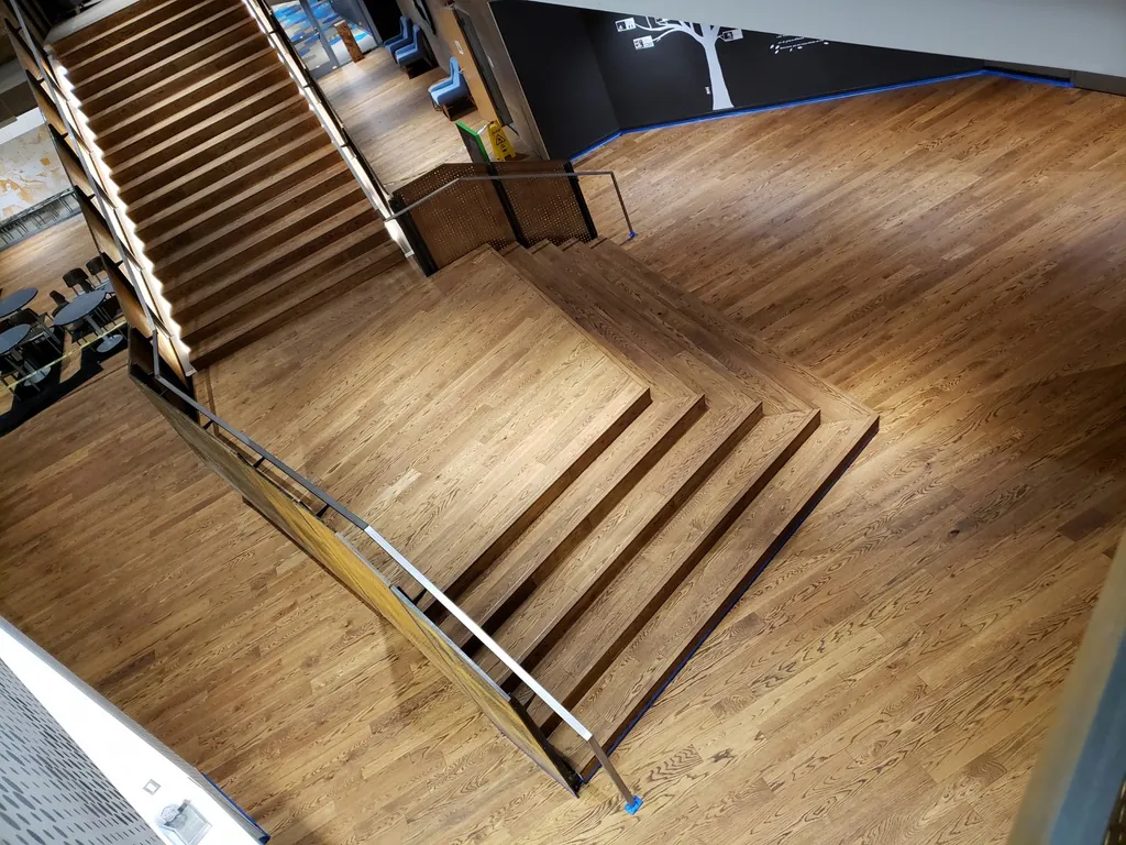 1 Wood Floors  Custom staircase dustless refinishing 2mm engineered oak Ann Arbor Michigan. Three-level commercial restoration. Installed by 1 Wood Floors, Livonia, MI