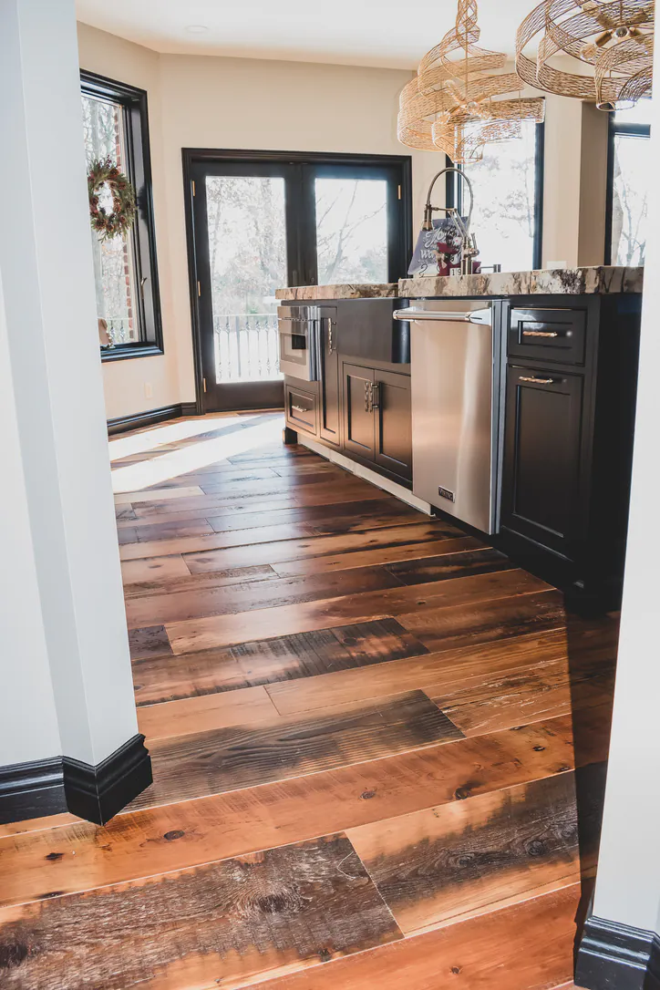 Wide hallway featuring restored antique Tobacco Pine flooring in Brighton Michigan