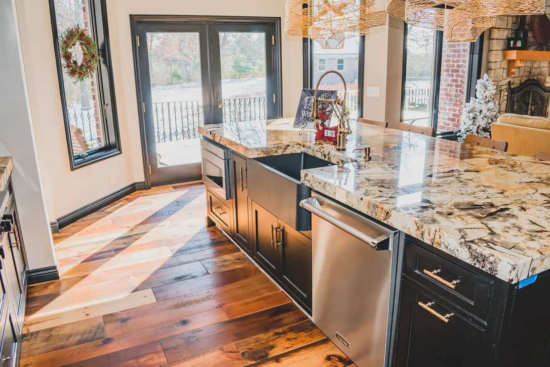 Reclaimed pine flooring in Brighton MI kitchen with farmhouse sink