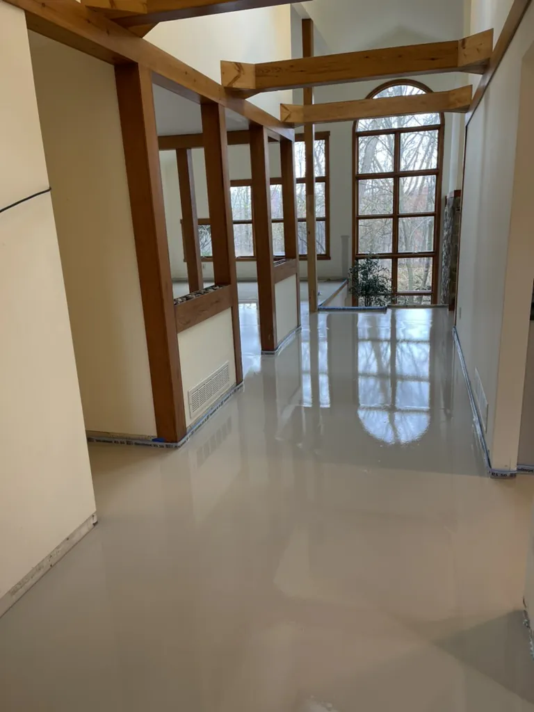 1 Wood Floors  Deep self-leveling underlayment pour correcting 1.5-inch height variances in Ann Arbor, Michigan. Installed by 1 Wood Floors, Livonia, MI