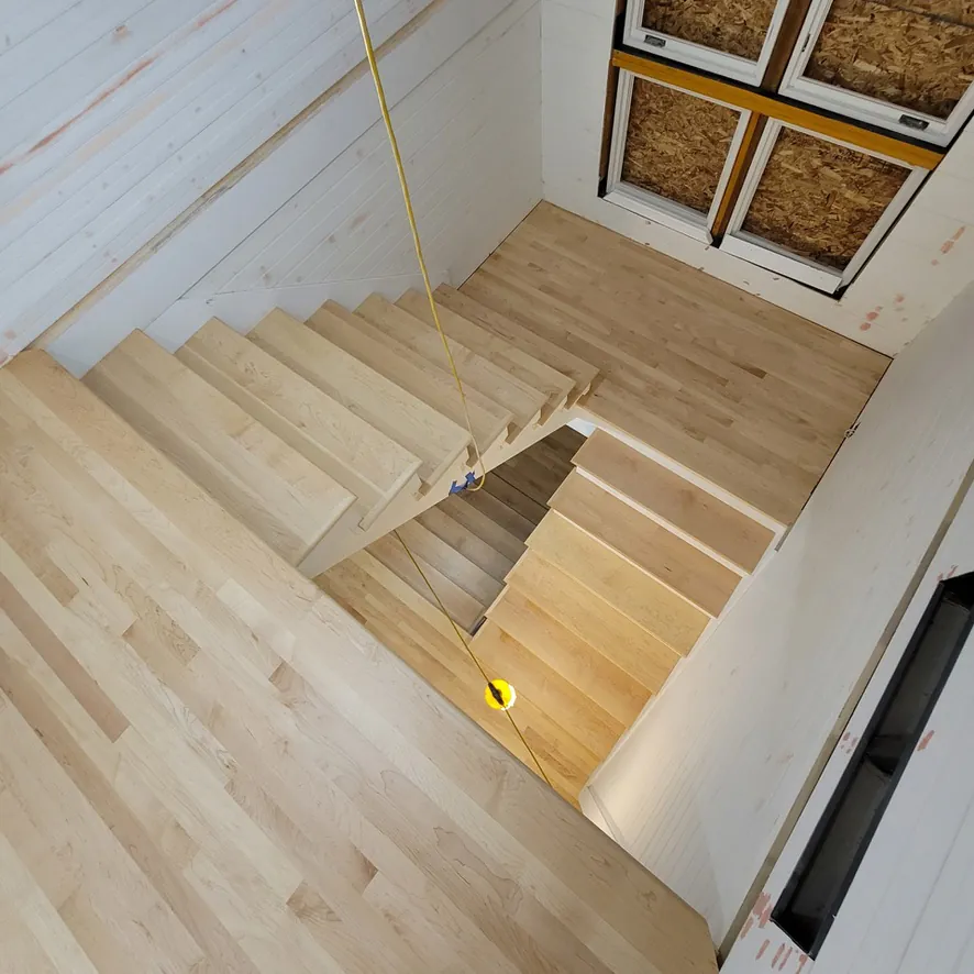 1 Wood Floors  Aerial view of maple staircase landings with invisible finish  Harbor Springs MI  Installed by 1 Wood Floors, Livonia, MI