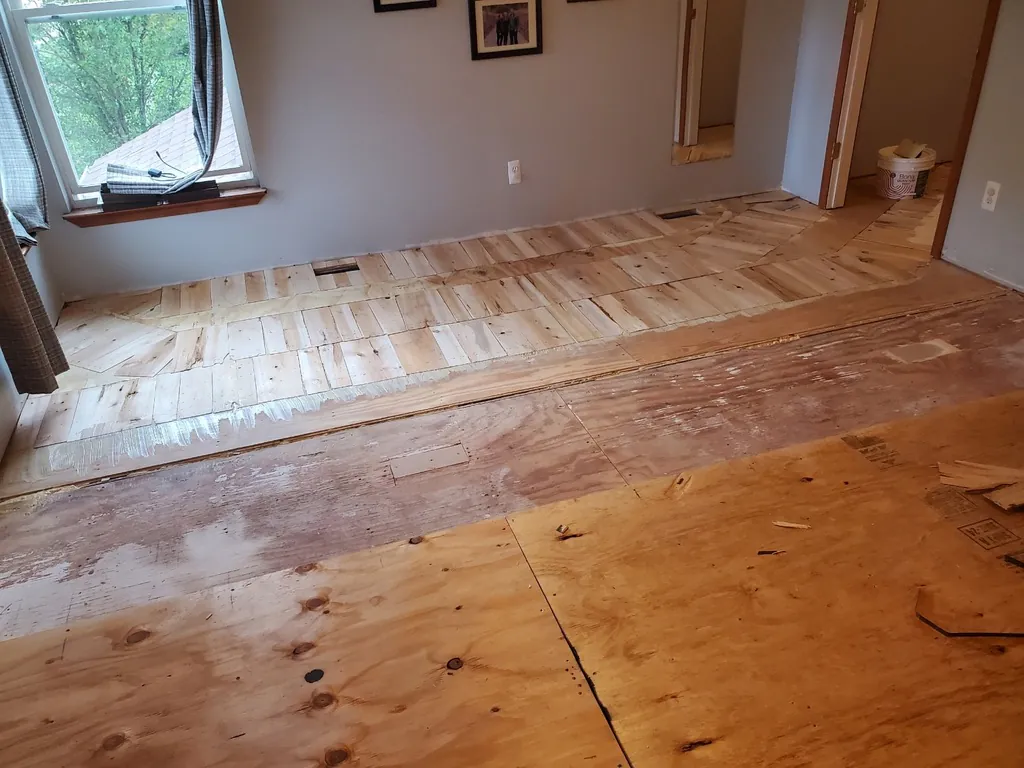 1 Wood Floors  Precision hard shim technique using layered plywood and wood shims to correct subfloor low spots