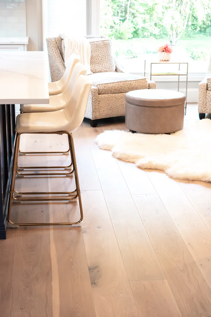 1 Wood Floors  Close-up of 8-inch wide-plank character grade White Oak flooring with 4.5mm sawn-face wear layer showing natural grain. Plymouth MI. Installed by 1 Wood Floors, Livonia, MI