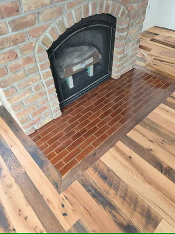 1 Wood Floors  Reclaimed antique oak flooring with brick fireplace hearth, Lexington, Michigan