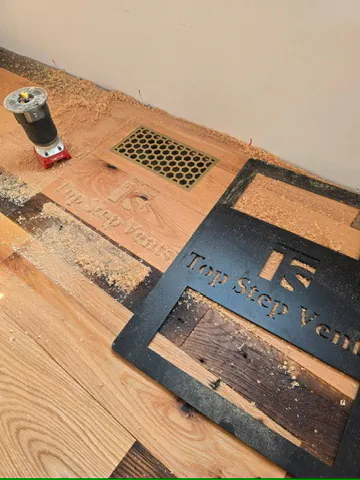 1 Wood Floors  Custom flush-mounted brass honeycomb register fabricated into reclaimed antique oak flooring. Lexington, Michigan