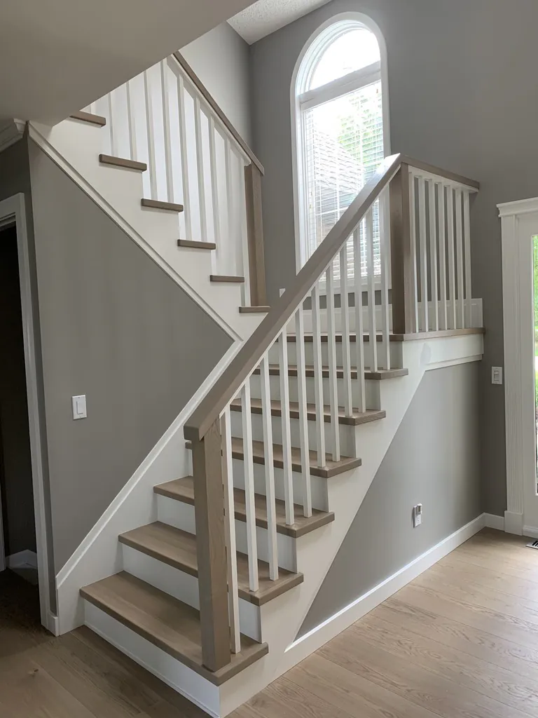 Custom color match of Boen European Oak Sand flooring to a minimalist modern staircase in Northville, Michigan by 1 Wood Floors